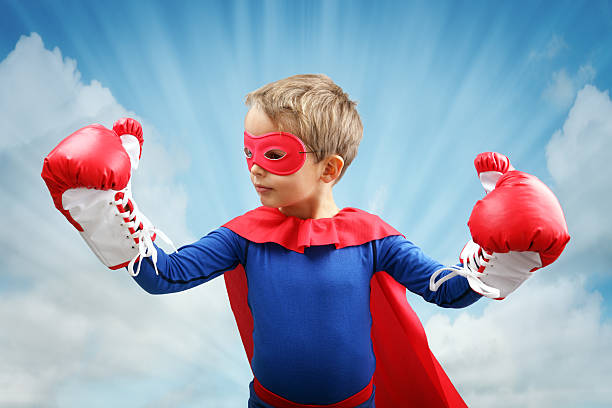 istock Superhero child with boxing gloves 525547563