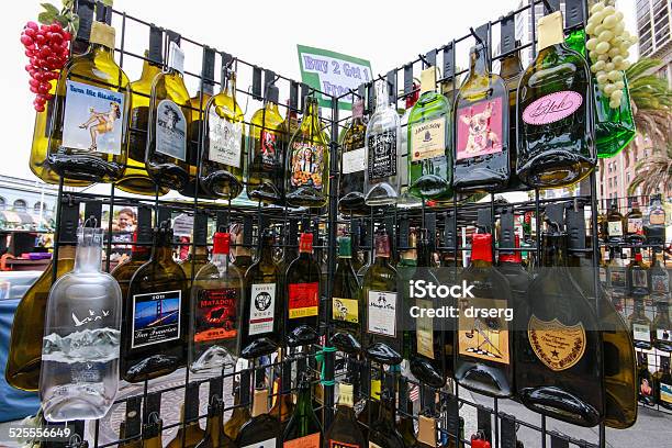 Rack With Empty Flat Souvenir Popular Alcohol Drinks Bottles Stock Photo - Download Image Now