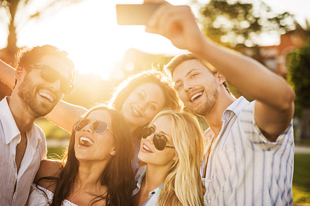 istock Selfie with smart phone at sunset. 525558561
