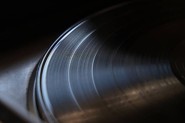 istock Close up of a vinyl record on a turntable 525562667