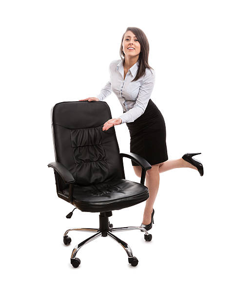 istock Sexy assistant inviting to relax on an office chair 525562861