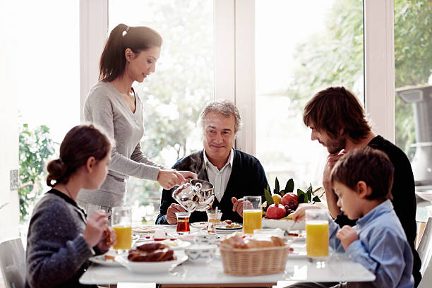 famiglia avendo colazione turco - grandfather adult affectionate little boys foto e immagini stock