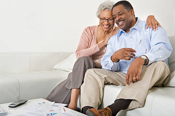 istock Happy Senior Couple Sitting On Couch 525563425