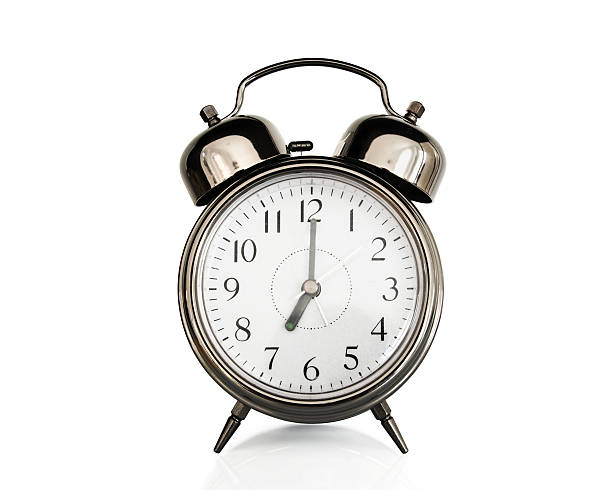 istock Seven on an old vintage alarm clock isolated on white 525567879