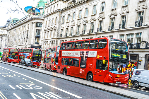London bus in motion in the street