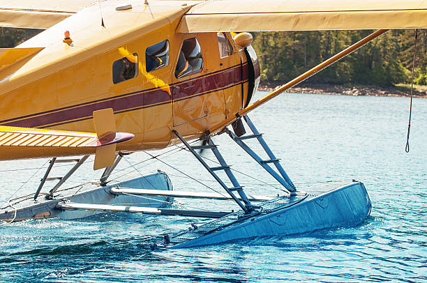 Bush Plane Departure A rotary engine bush plane departs for the wilderness. bush plane stock pictures, royalty-free photos & images