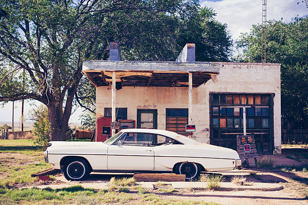 White Vintage American Car Reflected at Abandoned Gas Station Old fashioned car in USA  stock car photos stock pictures, royalty-free photos & images