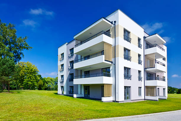 istock Modern apartment building in the park 525570871