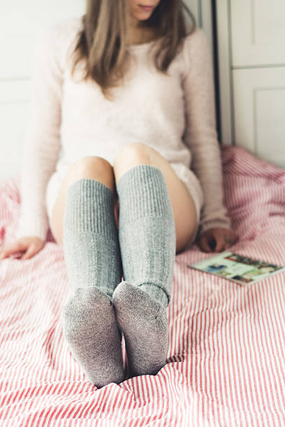 istock woman on the bed with tablet 525571673