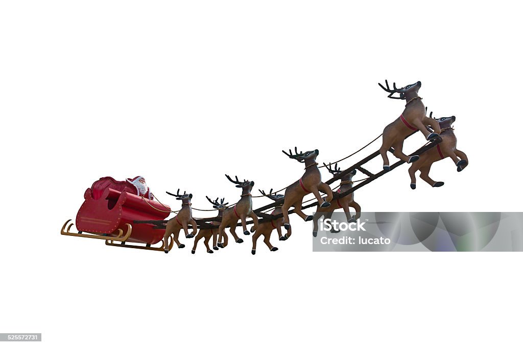Santa Claus is coming! Santa Claus riding a sleigh led by reindeers isolated on white background. Santa Claus Stock Photo
