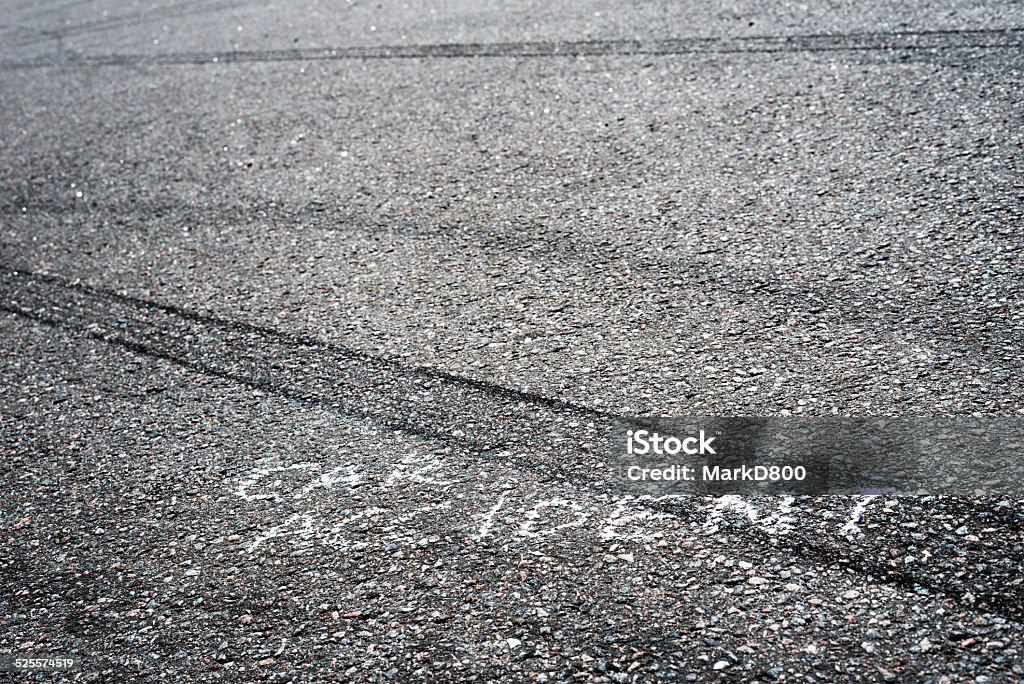 Car accident Car accident sign on the road, traces of braking distance after accident Asphalt Stock Photo