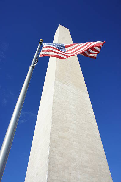 istock Washington Monument and American Flag 525574759