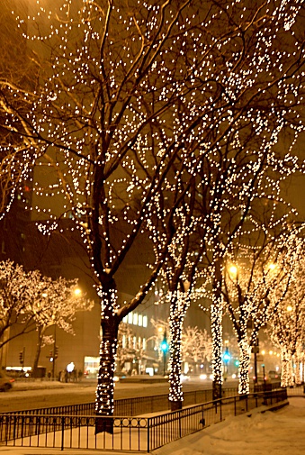 Chicago street decorated for a Christmas holidays season. Snow storm.