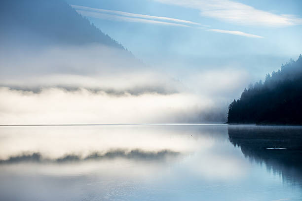 istock mountain alps lake at fall with mirroring dust 525583503