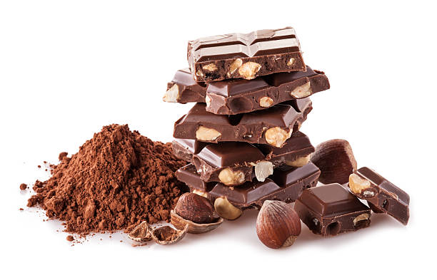 istock Pile of hazelnut cbocolate on white background 525584409