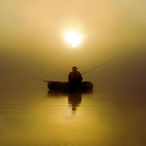 istock Fishermen in the morning mist 525584693