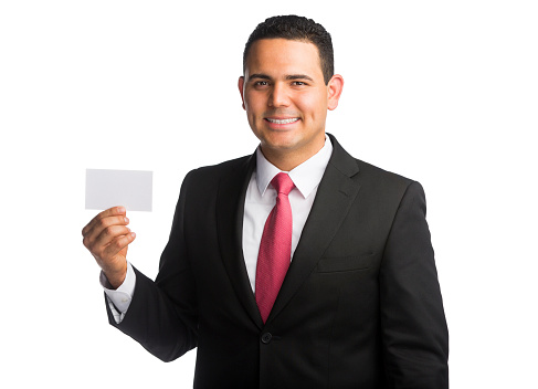 Businessman holding an empty visiting card isolated over white
