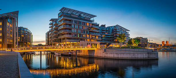 istock Oslo Aker Brygge waterfront developments illuminated above fjord harbour Norway 525585177