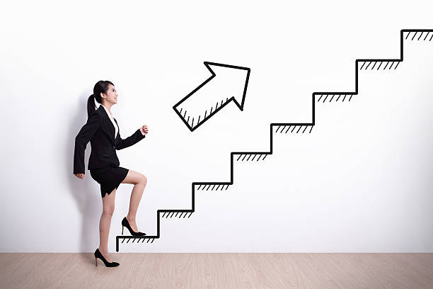 istock business woman with stair 525587217