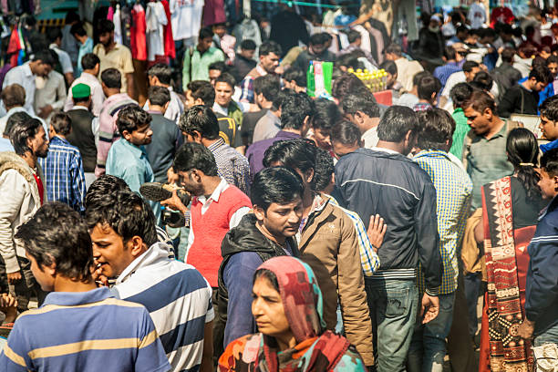 Old Delhi Old Delhi, India - March 9, 2014:  Afternoon crowd in Old Delhi. india crowd stock pictures, royalty-free photos & images