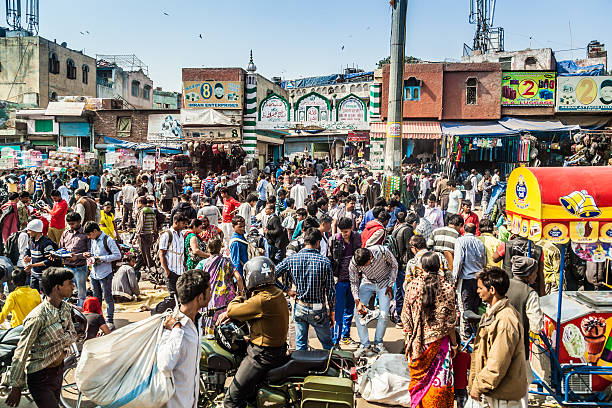 Old Delhi Old Delhi, India - March 9, 2014:  Afternoon crowd in Old Delhi. india crowd stock pictures, royalty-free photos & images