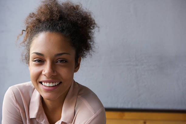 istock Happy young black woman smiling 525587691