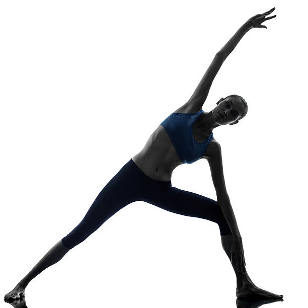 istock woman parighasana gate pose  yoga silhouette 525610849
