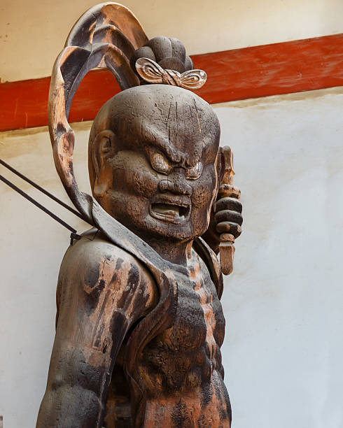 Nio (Benevolent Kings) at Daigo-ji Temple in Kyoto, Japan Kyoto, Japan - October 21 2014: Nio at Daigo-ji Temple, two wrath-filled, muscular guardians of the Buddha who commonly stand guard outside the Japanese temple gate. shingon buddhism stock pictures, royalty-free photos & images