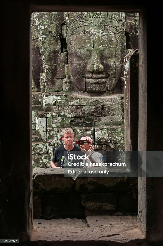 cambodia travel Siem Reap,Cambodia - October 02,2009 : Unidentified tourists visiting Bayon temple of Khmer as the official state temple of the Mahayana Buddhist King Jayavarman VII at Angkor Thom in Siem Reap of Cambodia.The Bayon stands at the centre of Jayavarman's capital. Ancient Stock Photo