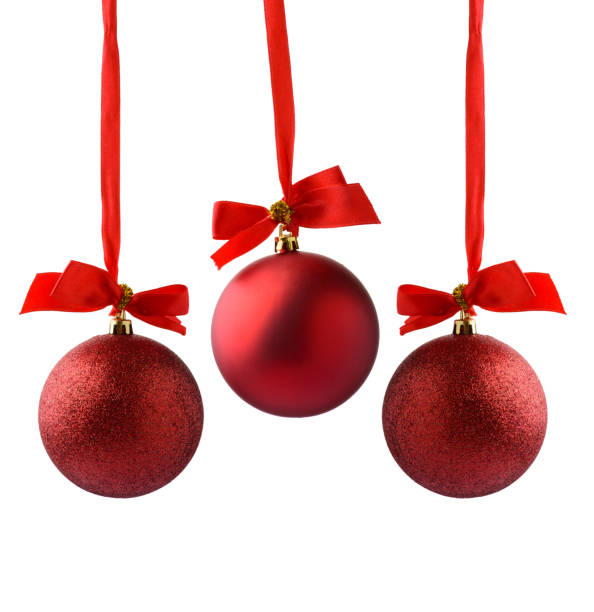 istock christmas ball hanging on ribbon isolated on white 525614493