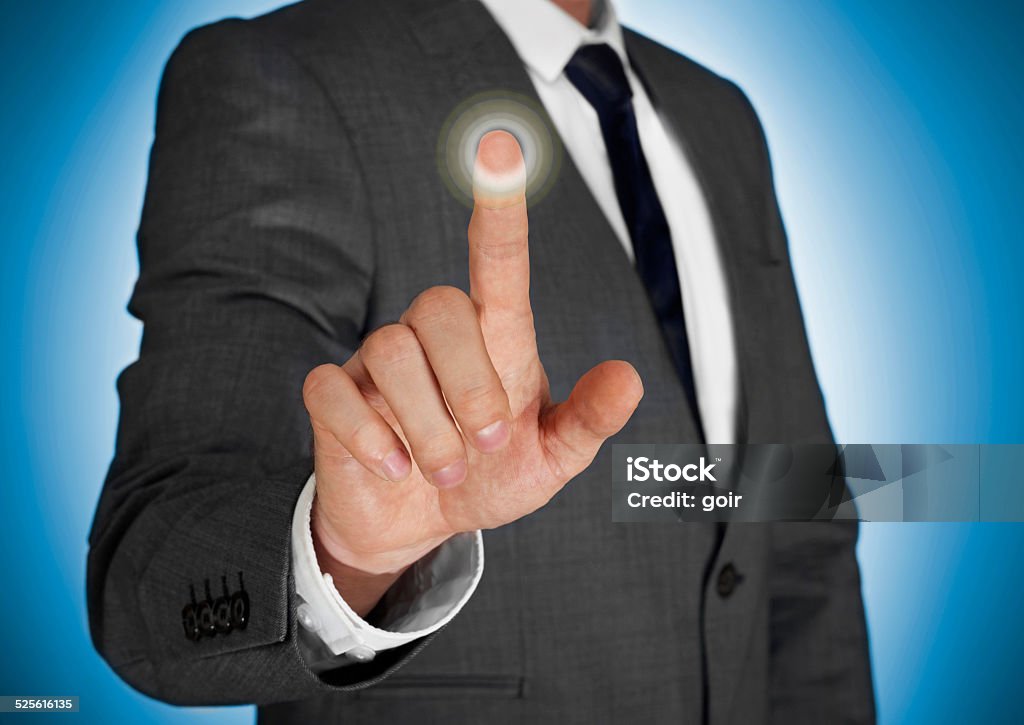 Businessman touching a virtual screen Abstract Stock Photo