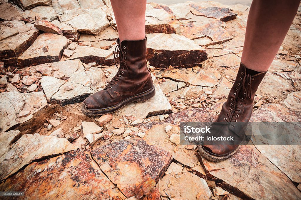 The feet of a young woman standing on some rocks The feet of a young woman as she is standing on a rocky surface Activity Stock Photo