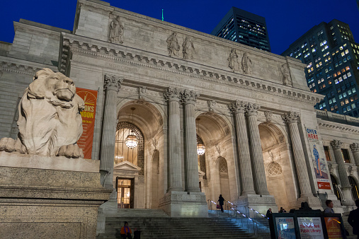 New York, NY, USA - November 5, 2014: the exterior evening view of New York Public Library (also known as Stephen A. Schwarzman Building), opened in 1911 and built in Beaux Arts style.