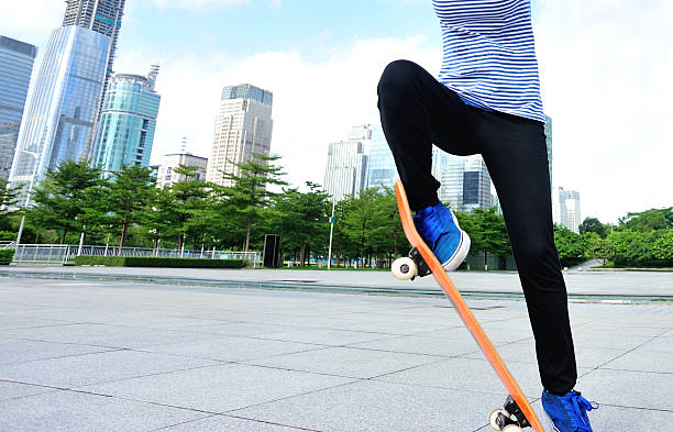 istock skateboarding woman jumping 525624679