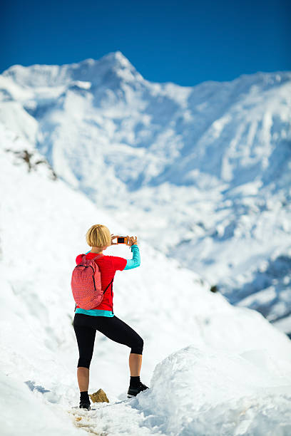 istock Woman taking photos on hiking trip 525627641