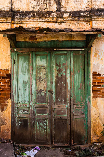 Vintage old door with brick wall stock photo