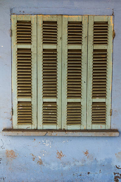 The old window with blue shutters. stock photo