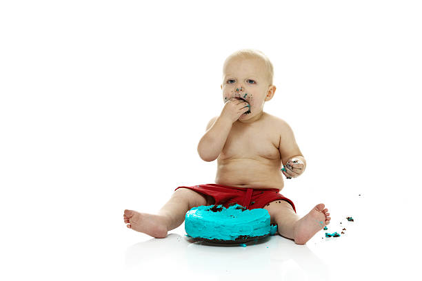 istock Baby boy eating his 1st birthday cake 525630805