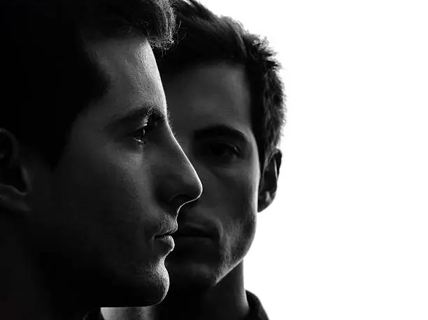 Photo of close up portrait two  men twin brother friends silhouette