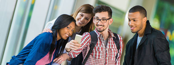 istock College Students Taking Selfie in the Corridor 525631201