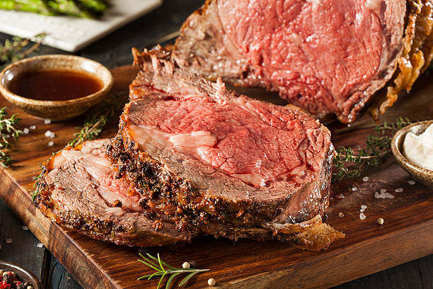 Homemade Grass Fed Prime Rib Roast Homemade Grass Fed Prime Rib Roast with Herbs and Spices prime rib stock pictures, royalty-free photos & images