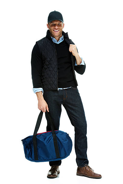 istock Cheerful man holding duffle bag 525637887