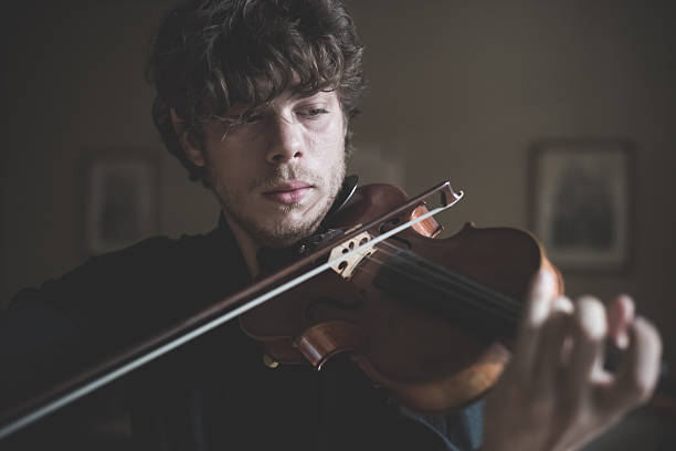 istock young handsome blonde violinist 525638097