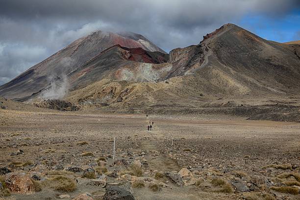 istock Volcano with hikers on walking track. 525639763