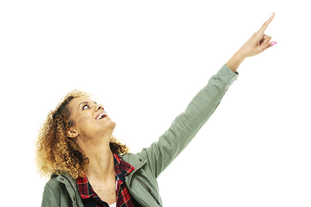 istock Cheerful woman pointing away 525639827