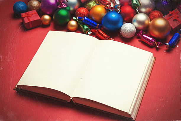 istock Book and chritmas toys on white background. 525640981