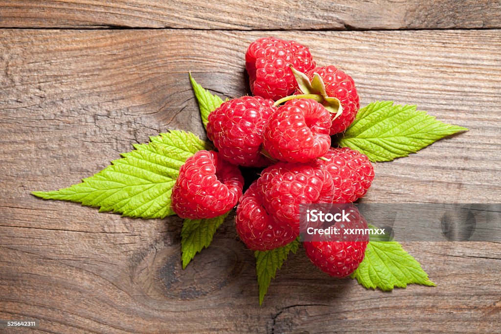Raspberry close up Close up of raspberry on old table. This file is cleaned and retouched. Above Stock Photo