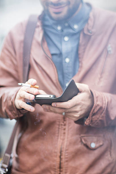 istock Mobile phone and smoke addiction 525642603