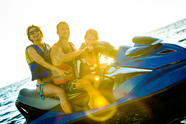 istock Family Riding  Jet Boat 525643141