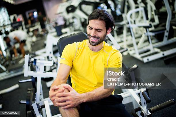 Knee Injury In The Gym Stock Photo - Download Image Now - Adult, Anaerobic Exercise, Body Building